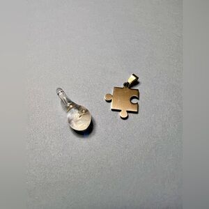 Silver-Toned Puzzle Piece Pendant and Clear Glass Teardrop Charm